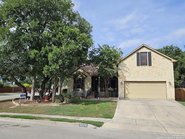 3524 Angora Trl, Schertz, TX 78154 - view of front of home featuring a garage, concrete driveway, and stone siding