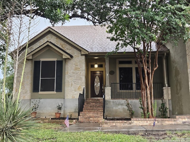 3524 Angora Trl, Schertz, TX 78154 - view of front of home with stone siding, a shingled roof, and a porch
