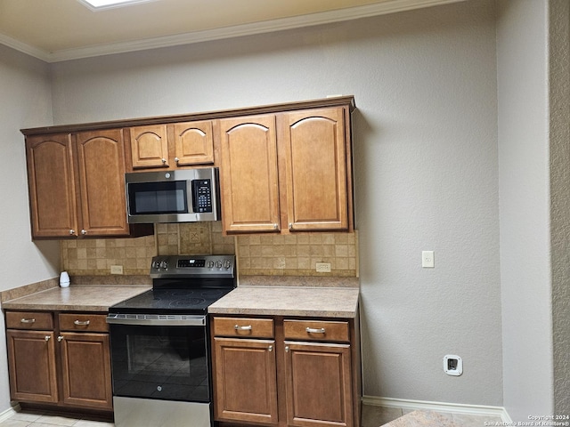 3524 Angora Trl, Schertz, TX 78154 - kitchen with stainless steel appliances, ornamental molding, tasteful backsplash, baseboards, and light countertops