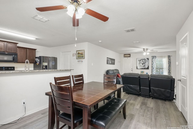 6631 Rosenthal Pass, San Antonio, TX 78252 - dining space featuring a ceiling fan and light wood finished floors