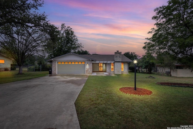 109 Briarwood, Kerrville, TX 78028 - view of front of house featuring concrete driveway, an attached garage, a chimney, and brick siding