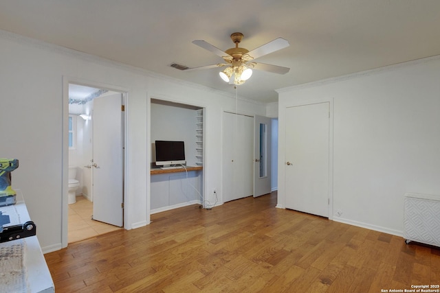 109 Briarwood, Kerrville, TX 78028 - unfurnished living room with ornamental molding, a ceiling fan, and light wood finished floors