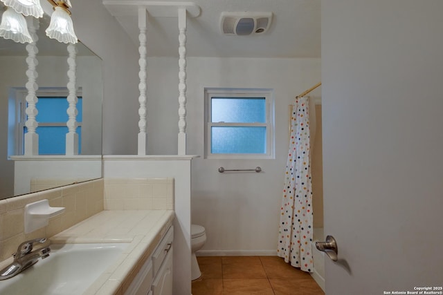 109 Briarwood, Kerrville, TX 78028 - bathroom with toilet, tile patterned floors, vanity, decorative backsplash, and a shower with shower curtain