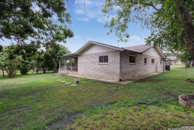 109 Briarwood, Kerrville, TX 78028 - view of side of property featuring a yard and brick siding