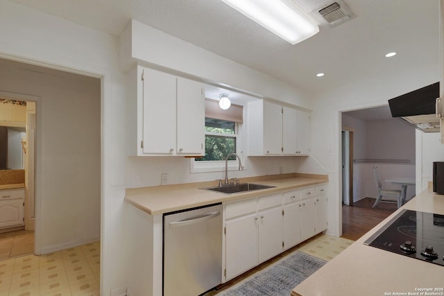 109 Briarwood, Kerrville, TX 78028 - kitchen with stainless steel dishwasher, a sink, black electric cooktop, light floors, and white cabinetry