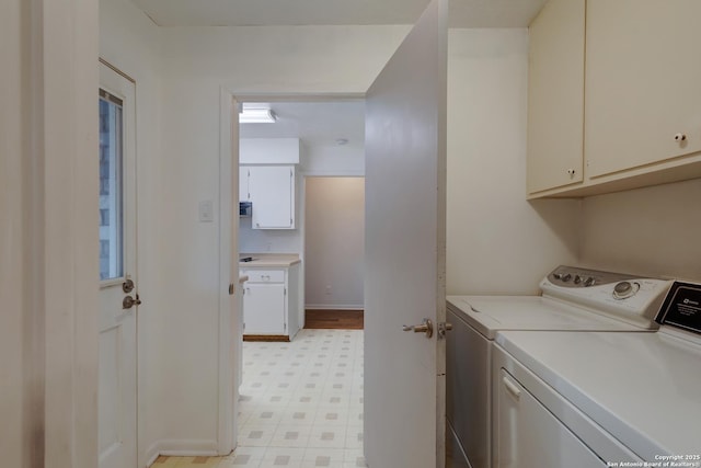 109 Briarwood, Kerrville, TX 78028 - laundry room featuring light flooring, independent washer and dryer, cabinet space, and baseboards
