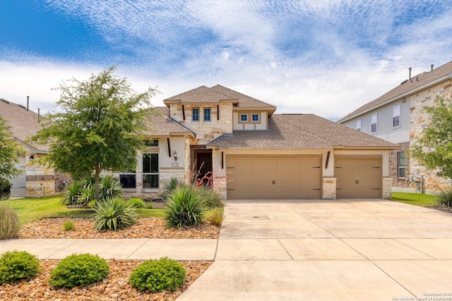116 Simpatico, Boerne, TX 78006 - prairie-style home with stone siding, an attached garage, concrete driveway, a shingled roof, and stucco siding