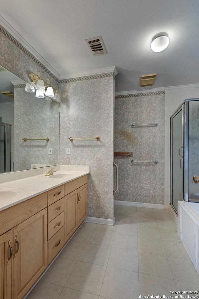 1306 Lytle, Kerrville, TX 78028 - full bath with a stall shower, double vanity, crown molding, and tile patterned flooring