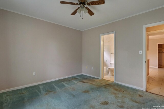 1306 Lytle, Kerrville, TX 78028 - unfurnished bedroom with ornamental molding, carpet flooring, baseboards, ensuite bathroom, and a ceiling fan