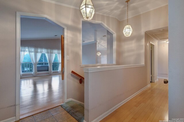 1306 Lytle, Kerrville, TX 78028 - hall with attic access, ornamental molding, baseboards, and wood finished floors