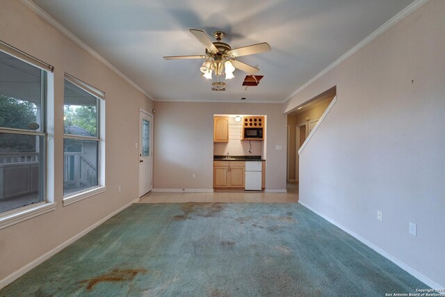 1306 Lytle, Kerrville, TX 78028 - unfurnished living room featuring light colored carpet, ceiling fan, crown molding, and baseboards