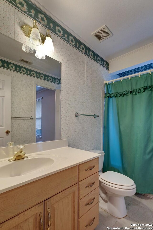 1306 Lytle, Kerrville, TX 78028 - full bathroom with toilet, tile patterned flooring, vanity, a shower with curtain, and ornamental molding