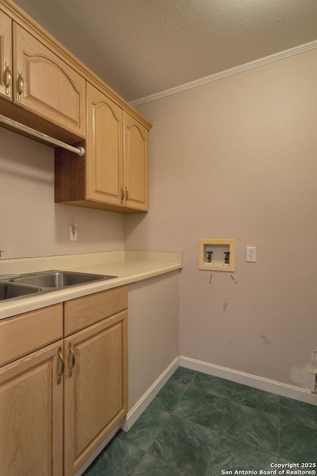 1306 Lytle, Kerrville, TX 78028 - washroom featuring washer hookup, ornamental molding, cabinet space, baseboards, and a textured ceiling