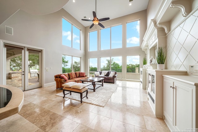 19223 Terra Rock, San Antonio, TX 78255 - living area with french doors, a towering ceiling, ceiling fan, baseboards, and recessed lighting