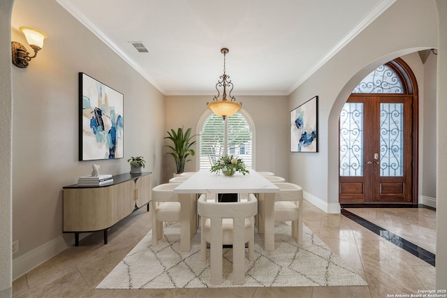 19223 Terra Rock, San Antonio, TX 78255 - dining space featuring arched walkways, baseboards, crown molding, and french doors