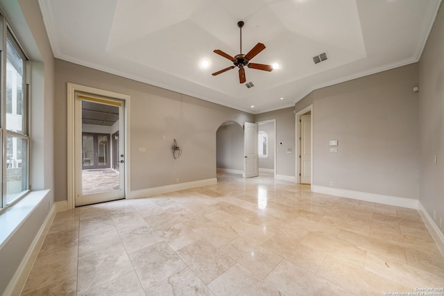 19223 Terra Rock, San Antonio, TX 78255 - unfurnished room with arched walkways, a ceiling fan, a tray ceiling, ornamental molding, and baseboards