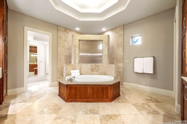 19223 Terra Rock, San Antonio, TX 78255 - bathroom featuring a garden tub, baseboards, a raised ceiling, and recessed lighting