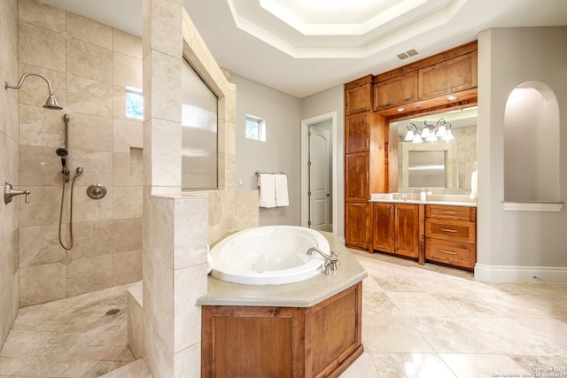 19223 Terra Rock, San Antonio, TX 78255 - bathroom featuring a bath, a walk in shower, vanity, a raised ceiling, and tile patterned floors