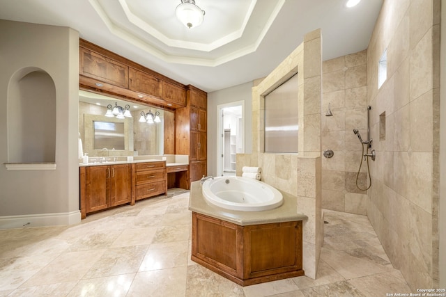 19223 Terra Rock, San Antonio, TX 78255 - bathroom with walk in shower, a bath, vanity, and a tray ceiling