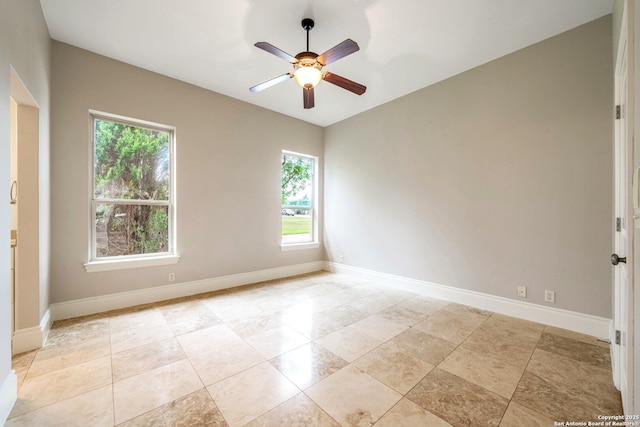 19223 Terra Rock, San Antonio, TX 78255 - empty room with plenty of natural light, a ceiling fan, and baseboards