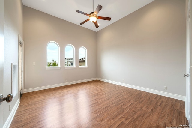 19223 Terra Rock, San Antonio, TX 78255 - unfurnished room with a ceiling fan, wood finished floors, baseboards, and high vaulted ceiling