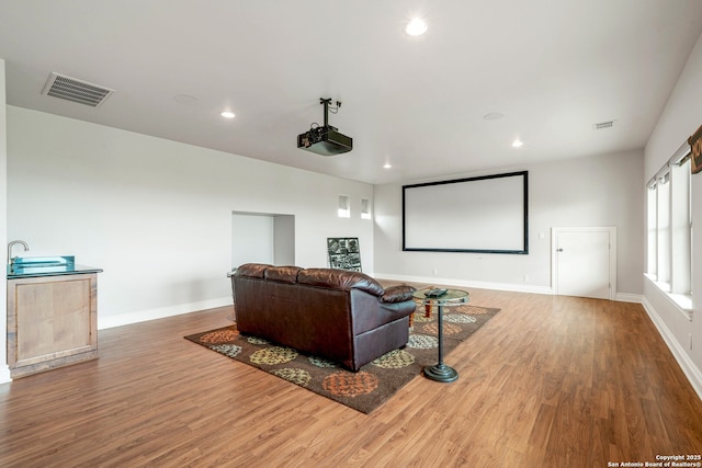 19223 Terra Rock, San Antonio, TX 78255 - cinema room featuring wood finished floors, baseboards, and recessed lighting