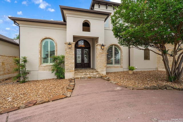19223 Terra Rock, San Antonio, TX 78255 - doorway to property with french doors, stucco siding, and stone siding