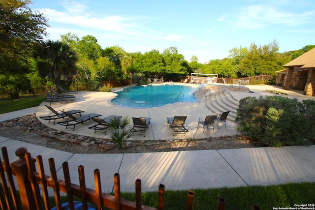 19223 Terra Rock, San Antonio, TX 78255 - view of swimming pool featuring a patio area and view of wooded area