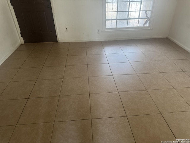 3711 Southport, San Antonio, TX 78223 - tiled empty room with baseboards