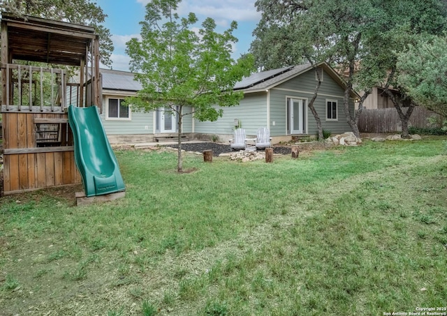 7122 Ranch Hill Dr, San Antonio, TX 78250 - back of property with a playground and roof mounted solar panels