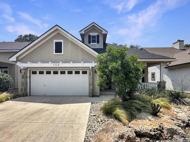 106 Serenity, Boerne, TX 78006 - traditional home featuring concrete driveway, a shingled roof, stucco siding, an attached garage, and a porch