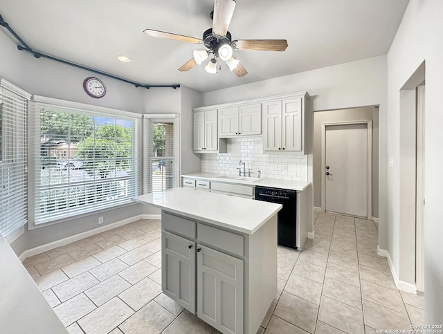 106 Serenity, Boerne, TX 78006 - kitchen featuring a sink, black dishwasher, light countertops, decorative backsplash, and light tile patterned floors