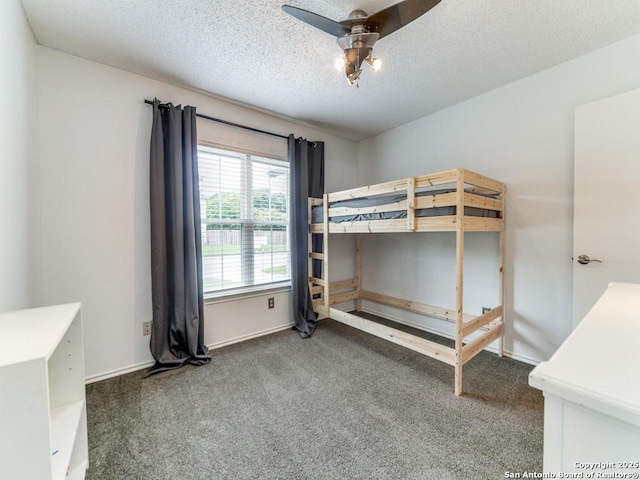 16402 Blanco Ky, San Antonio, TX 78247 - unfurnished bedroom featuring carpet, a textured ceiling, a ceiling fan, and baseboards