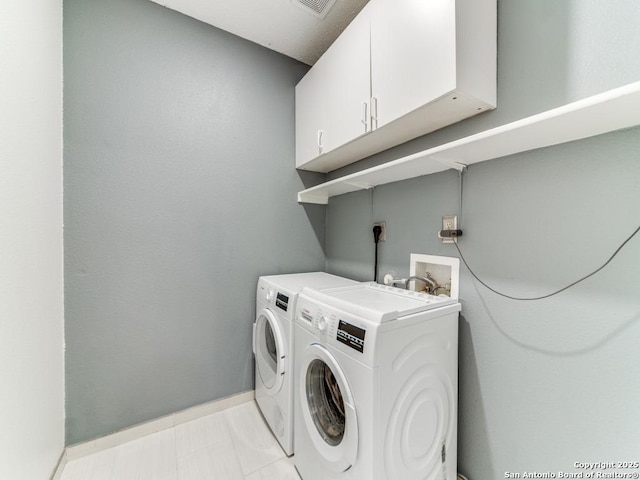 16402 Blanco Ky, San Antonio, TX 78247 - laundry room featuring cabinet space, independent washer and dryer, and baseboards
