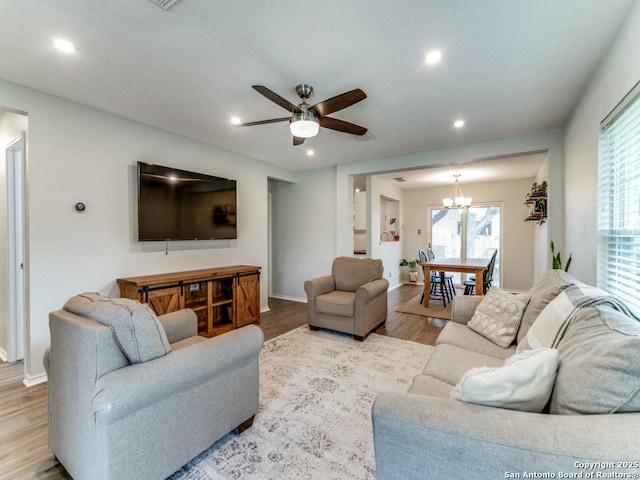 16402 Blanco Ky, San Antonio, TX 78247 - living area with a chandelier, wood finished floors, ceiling fan, baseboards, and recessed lighting