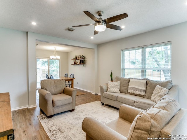 16402 Blanco Ky, San Antonio, TX 78247 - living room featuring a ceiling fan, wood finished floors, a chandelier, recessed lighting, and baseboards