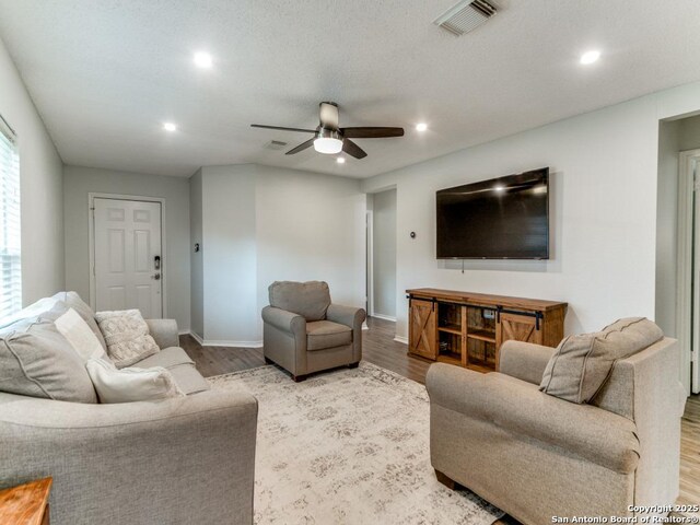 16402 Blanco Ky, San Antonio, TX 78247 - living room featuring a ceiling fan, recessed lighting, wood finished floors, and baseboards