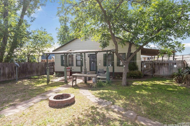 859 Pine St, New Braunfels, TX 78130 - back of property featuring a fire pit and a patio area