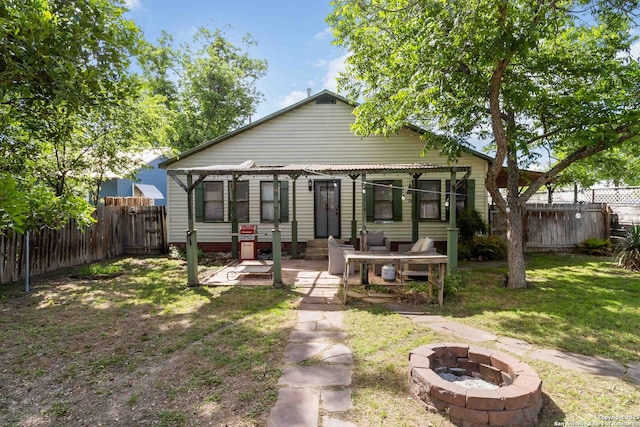 859 Pine St, New Braunfels, TX 78130 - back of house with an outdoor fire pit and a patio