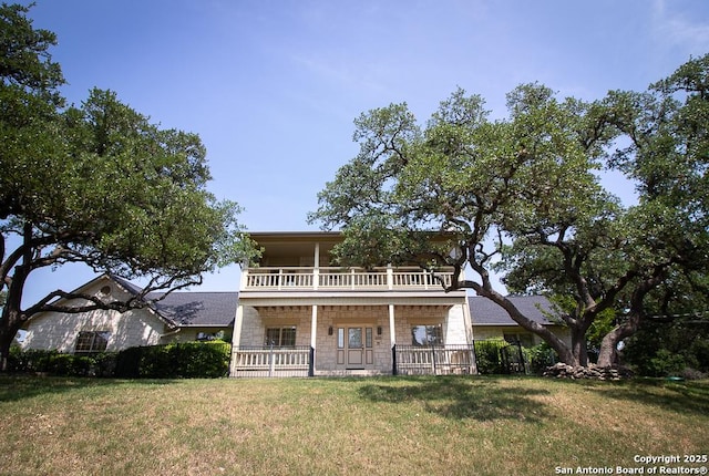 8333 Triple Crown, Boerne, TX 78015 - view of front of property with covered porch, a balcony, and a front yard