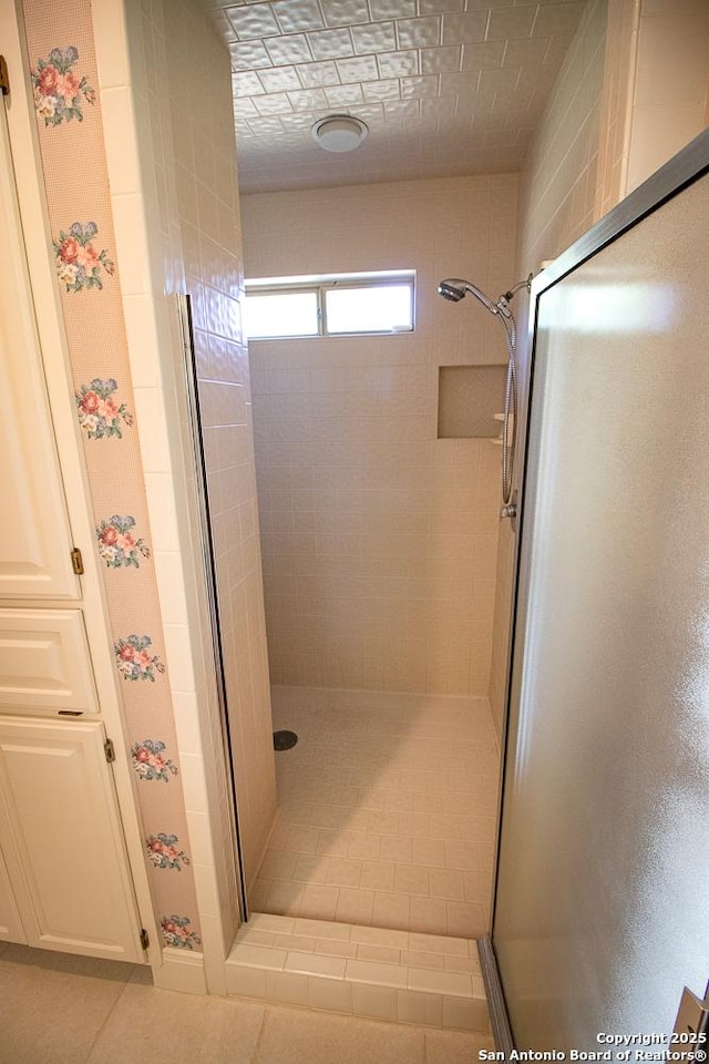 8333 Triple Crown, Boerne, TX 78015 - bathroom featuring a stall shower and tile patterned floors