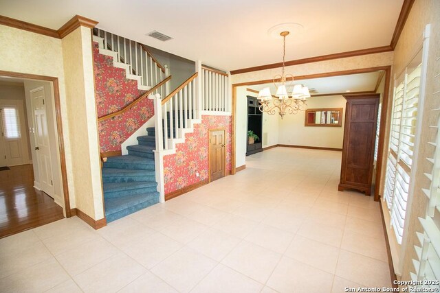 8333 Triple Crown, Boerne, TX 78015 - interior space featuring stairway, a chandelier, baseboards, crown molding, and wallpapered walls