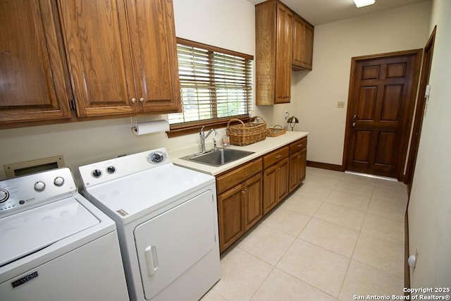 8333 Triple Crown, Boerne, TX 78015 - laundry room with washer and clothes dryer, cabinet space, light tile patterned floors, and baseboards