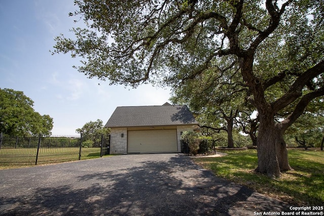 8333 Triple Crown, Boerne, TX 78015 - view of front facade featuring gravel driveway, stone siding, and a garage
