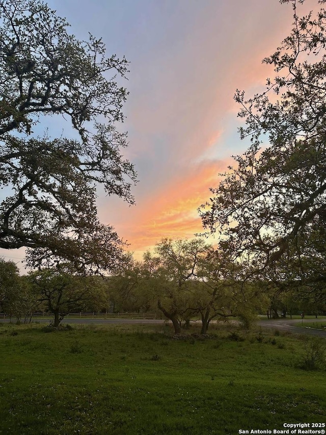 8333 Triple Crown, Boerne, TX 78015 - yard at dusk with a rural view