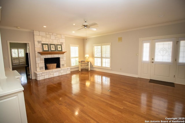 8333 Triple Crown, Boerne, TX 78015 - unfurnished living room featuring a ceiling fan, ornamental molding, wood finished floors, plenty of natural light, and a fireplace