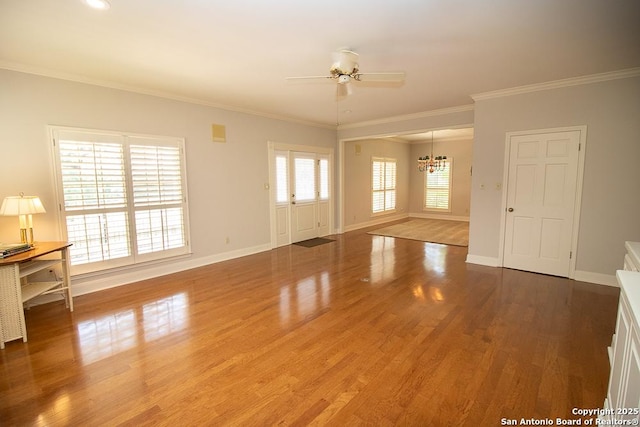 8333 Triple Crown, Boerne, TX 78015 - unfurnished living room with a chandelier, ceiling fan, wood finished floors, baseboards, and ornamental molding
