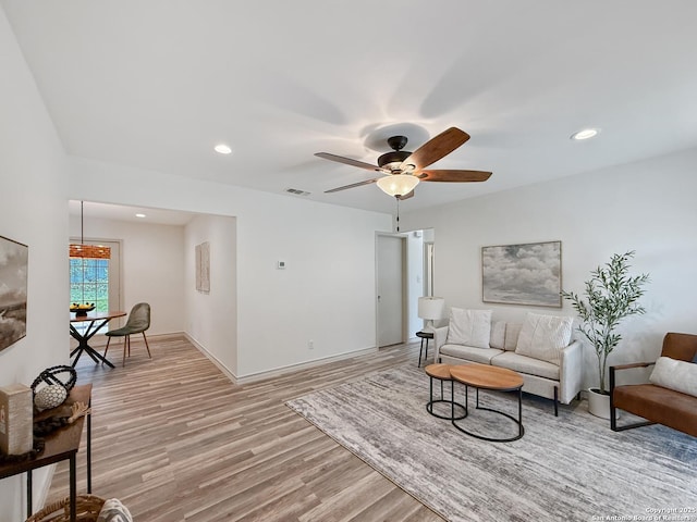 4015 Ramsgate, San Antonio, TX 78230 - living room with light wood-style floors, ceiling fan, recessed lighting, and baseboards
