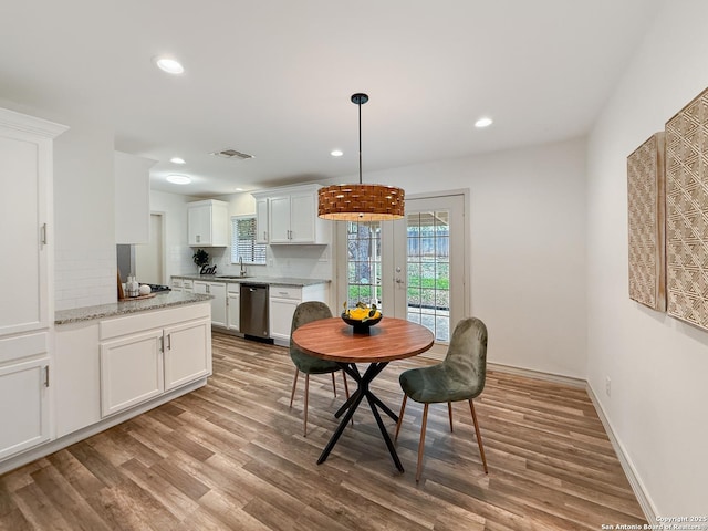 4015 Ramsgate, San Antonio, TX 78230 - dining space with french doors, wood finished floors, recessed lighting, and baseboards