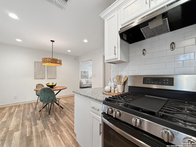 4015 Ramsgate, San Antonio, TX 78230 - kitchen featuring stainless steel gas range, ventilation hood, backsplash, white cabinetry, and light wood finished floors